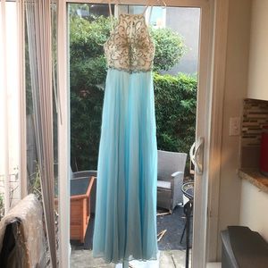 Prom or evening gown.  Brand: Xscape size 4